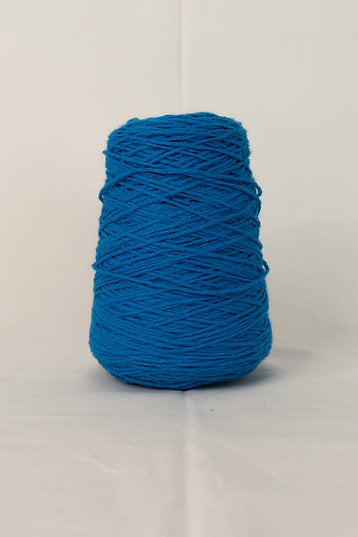 A large cone of solid azure blue acrylic yarn.