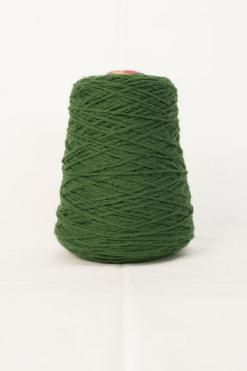 A green cone of acrylic tufting yarn.
