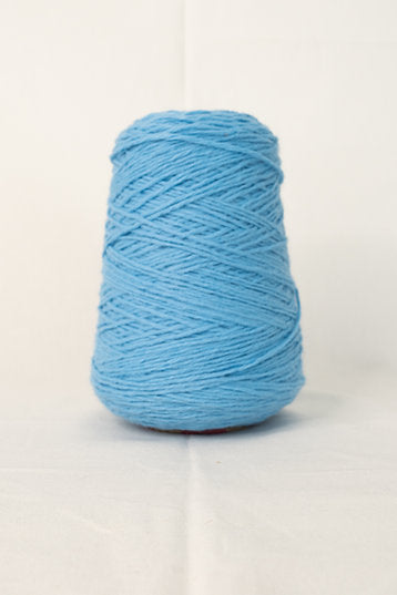 A cone of blue tufting yarn.
