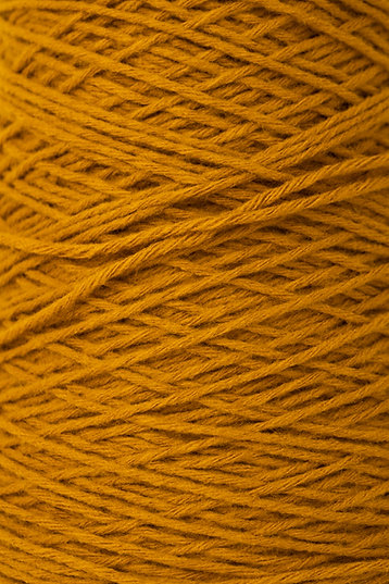 a close-up section of acrylic yarn in aciete colour showing the texture of the yarn.