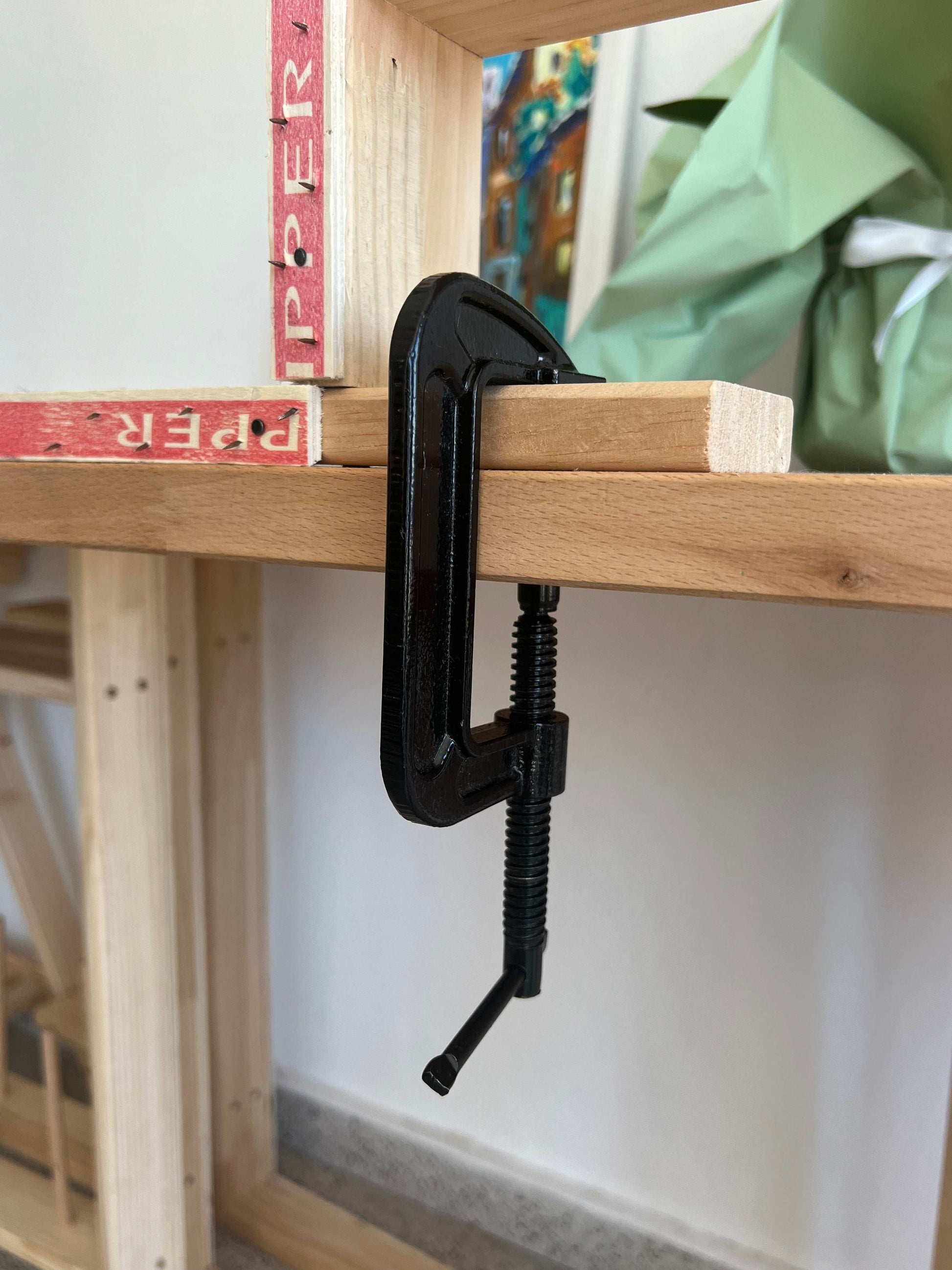 Table G Clamps attached to tufting frame