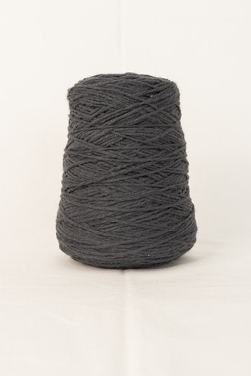 A cone of gray acrylic yarn designed for tufting projects.