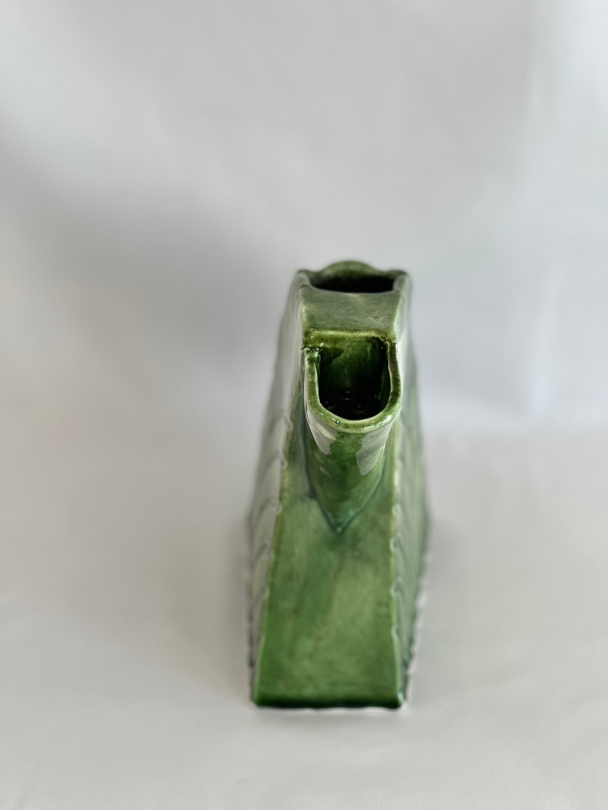 Handmade green ceramic jug