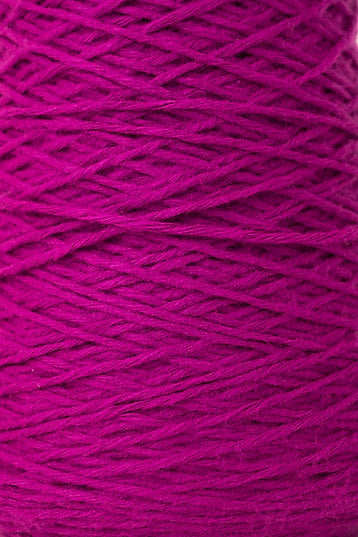 Close up of magenta tufting yarn