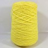 Yellow yarn cone on a white background
