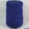 Blue yarn on a spool against a white background
