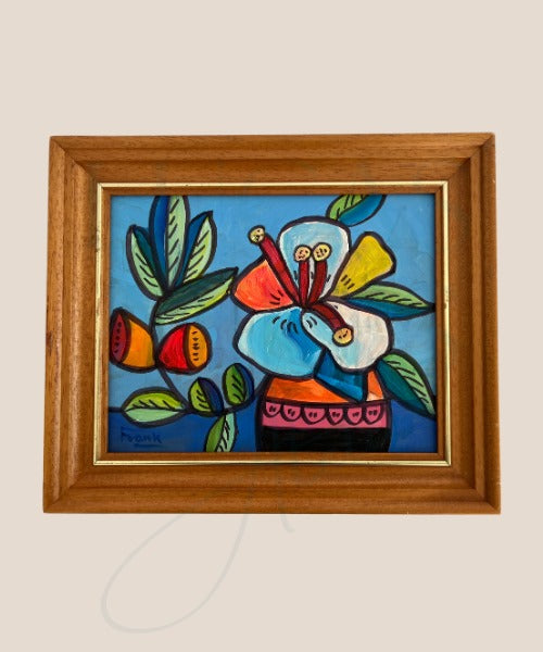 A framed still life painting featuring a vibrant floral design in a vase, with bold colors and strong outlines, signed and dated by the artist on the reverse.