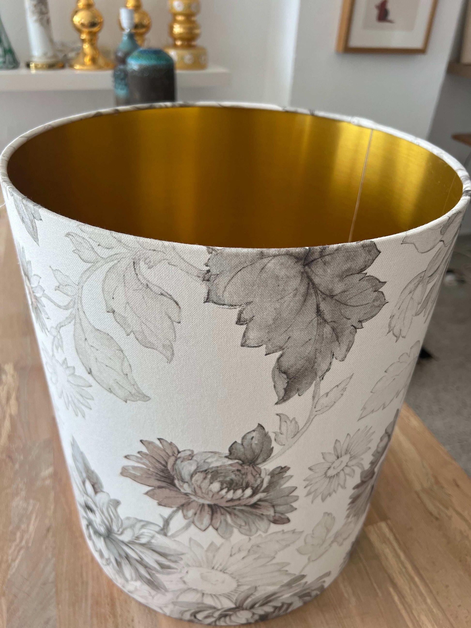 Close up grey and white Oversized Floral Lampshade with brushed gold interior