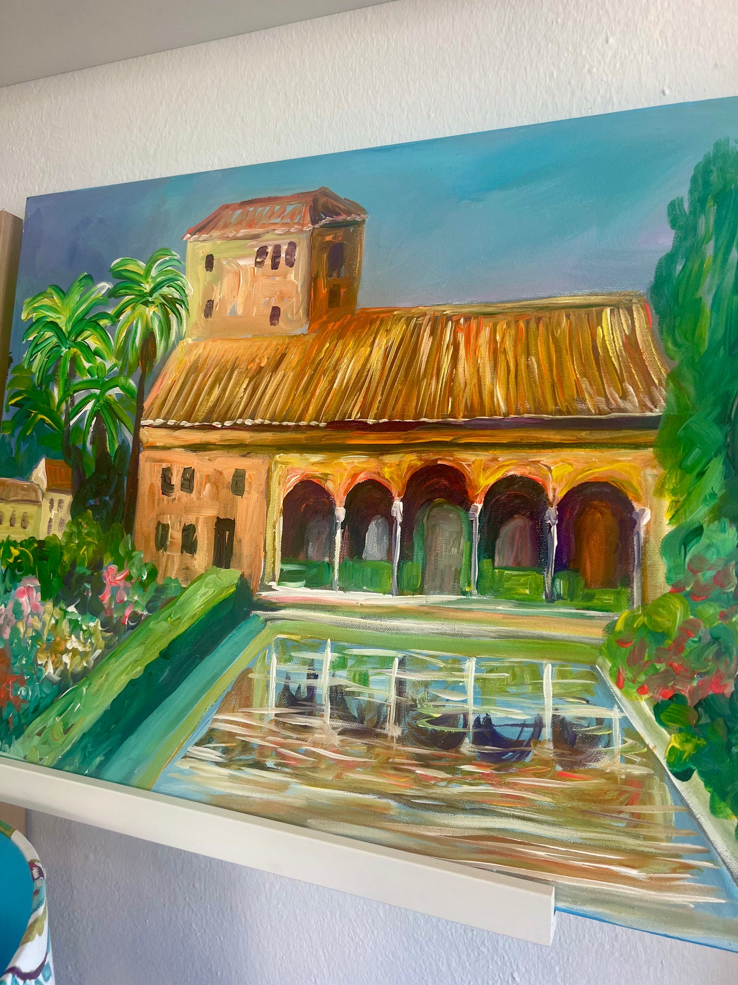 Painting of Alhambra with arched windows and a pool, surrounded by greenery.