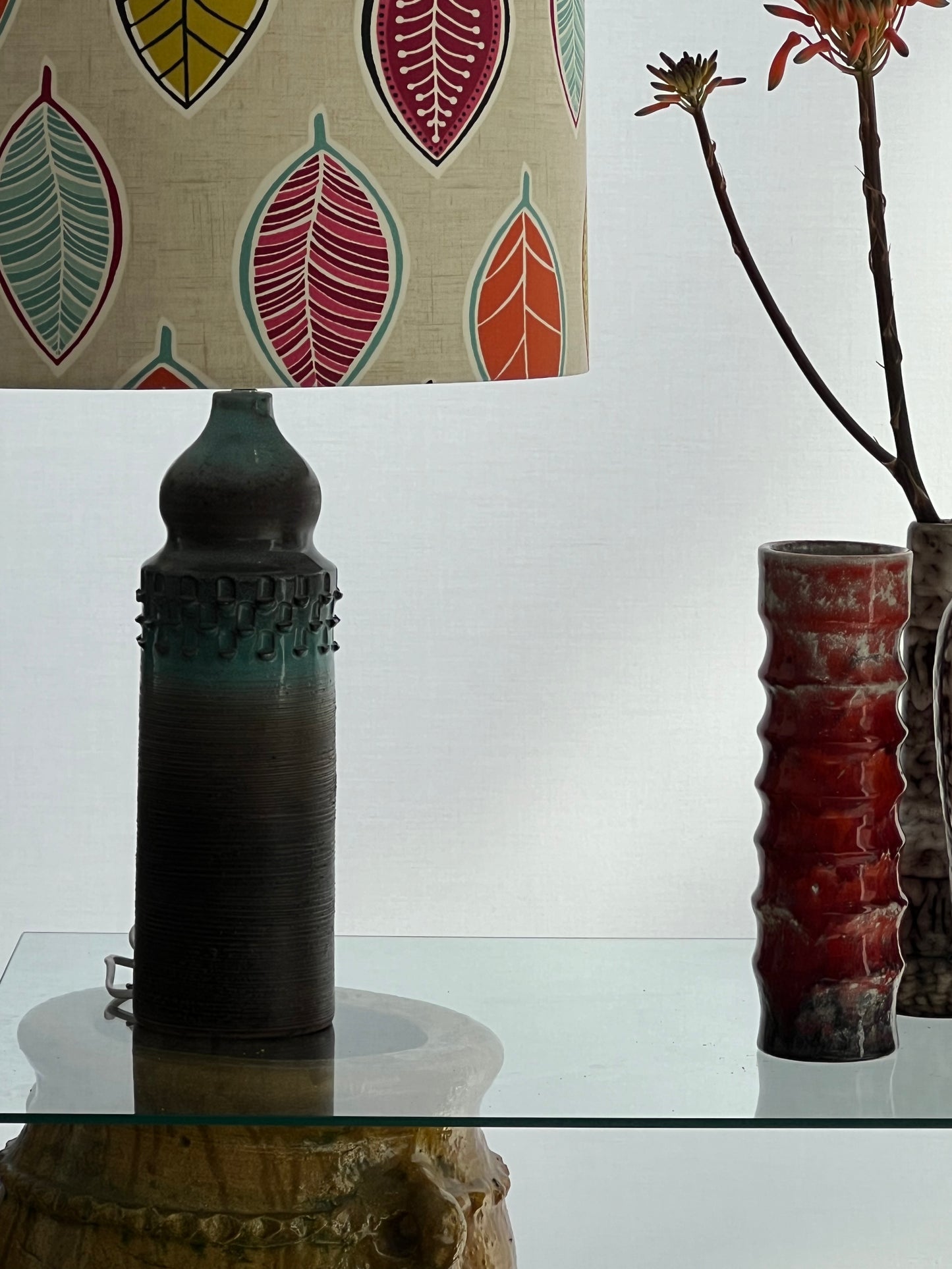 Lamp with leaf shade on table