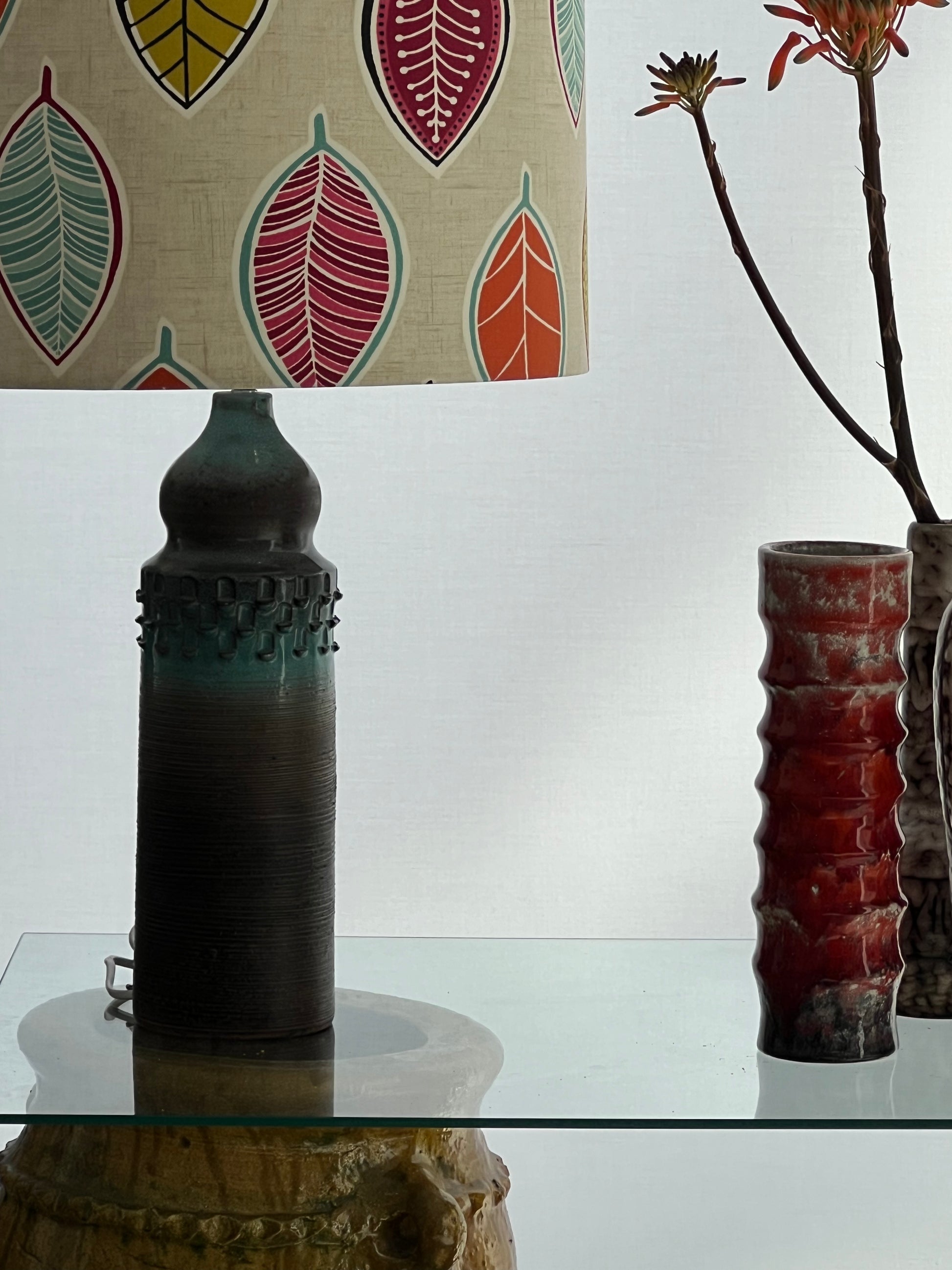 Lamp with leaf shade on table