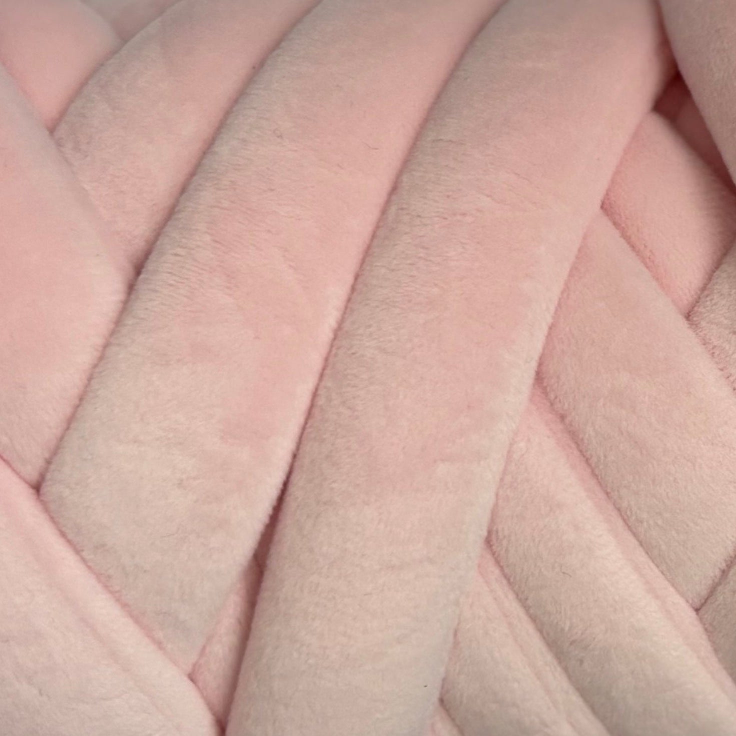 Close-up of pastel pink velvet yarn